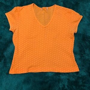 Retro, bright orange v-neck T-shirt with floral pattern